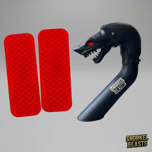 Black snorkel with shark design and red reflector lights on a gray background, featuring the Snorkel Beasts brand.